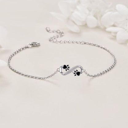 Bracelet avec symbole de l'infini, pendentif avec empreinte de patte et zircons