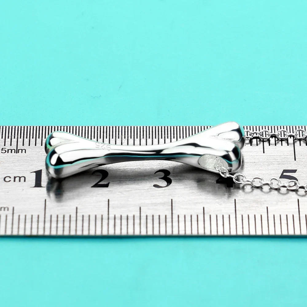 collier avec pendentif en forme d'os pour chiens