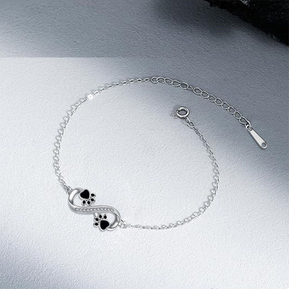 Bracelet avec symbole de l'infini, pendentif avec empreinte de patte et zircons